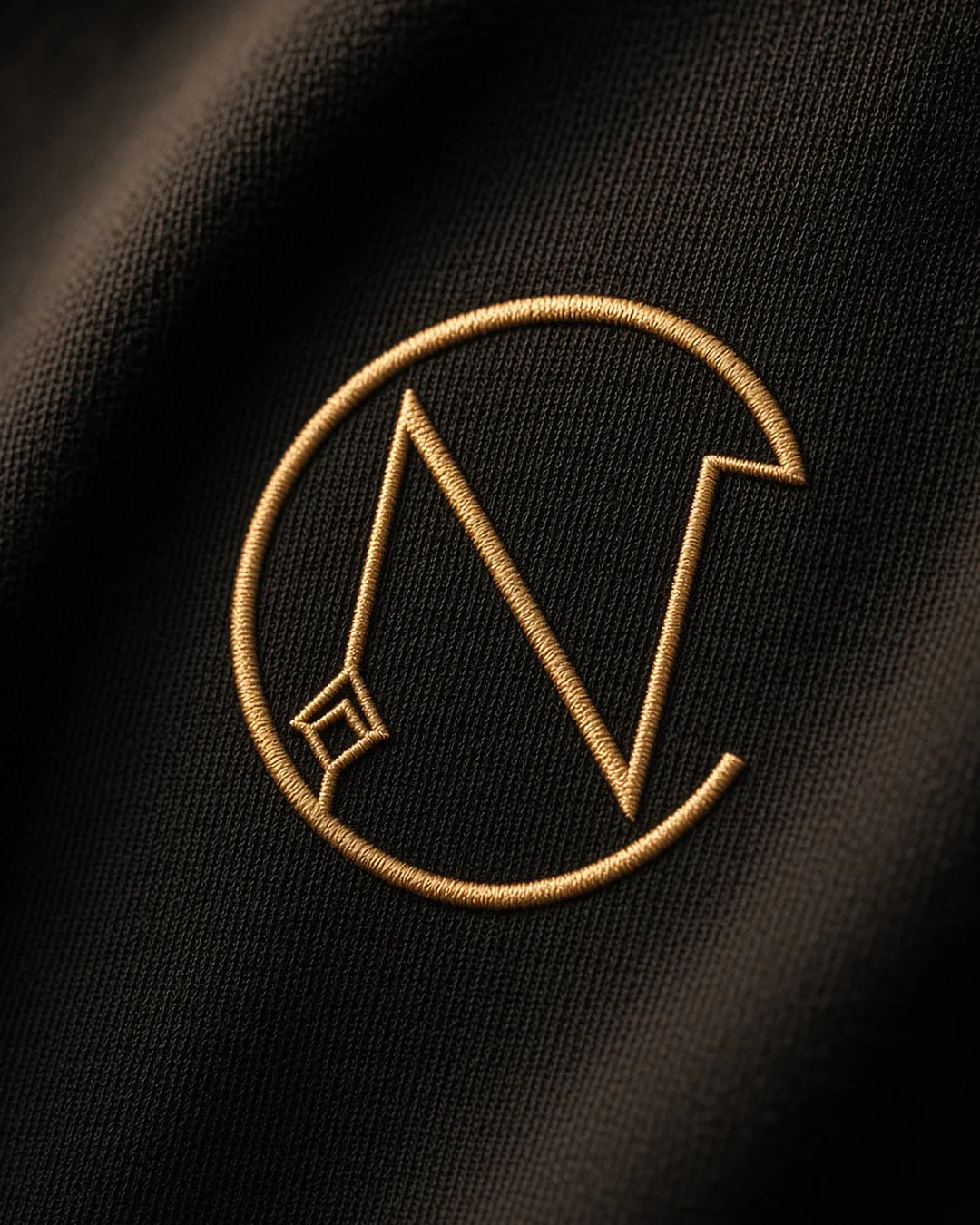 Nuvira Cantono Crest monogram in champagne-gold embroidery